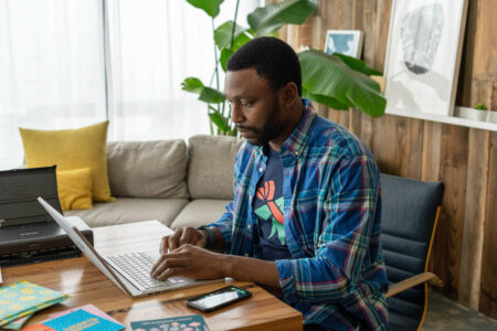 man creating a LinkedIn profile using a laptop