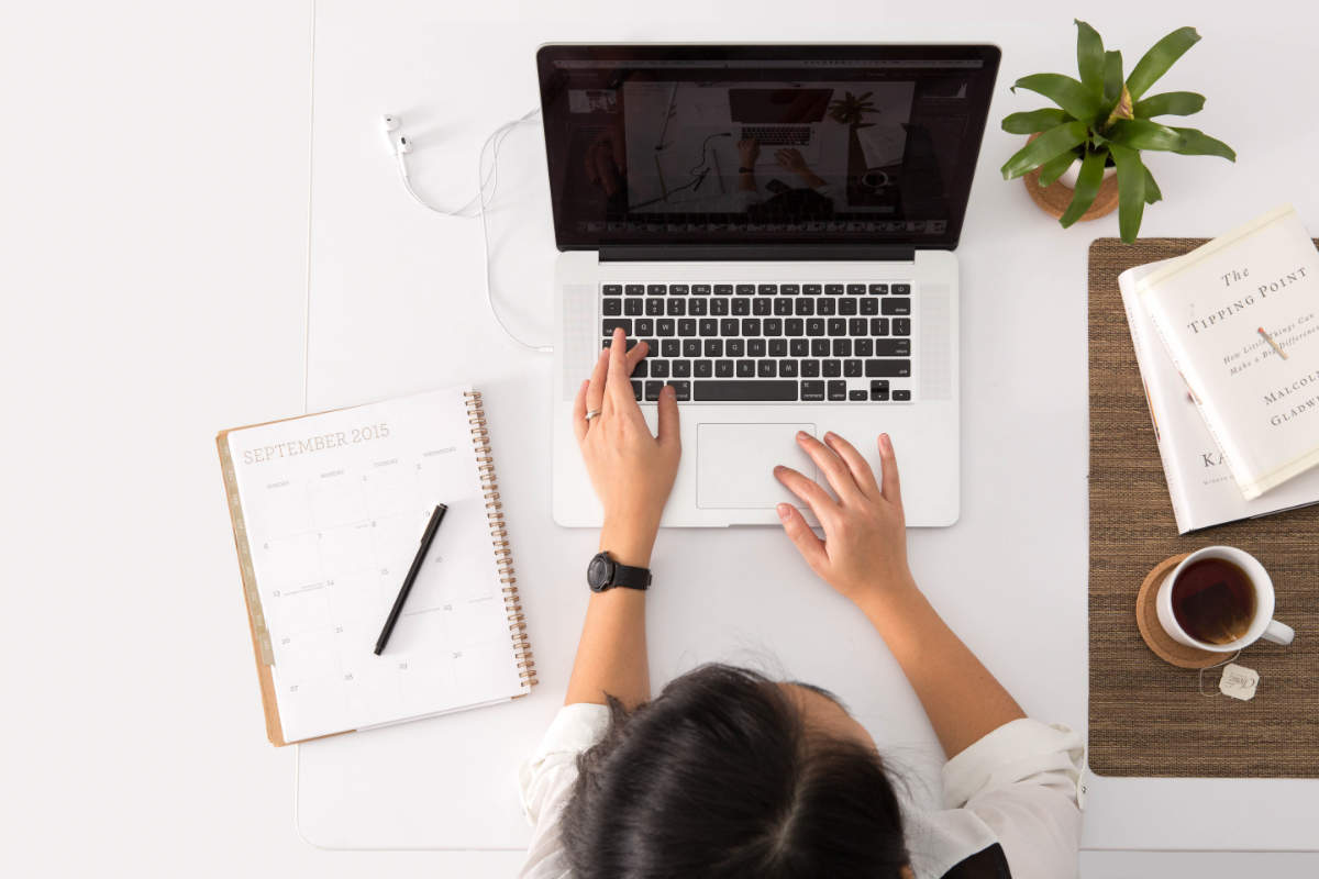 digital copywriter working on a laptop