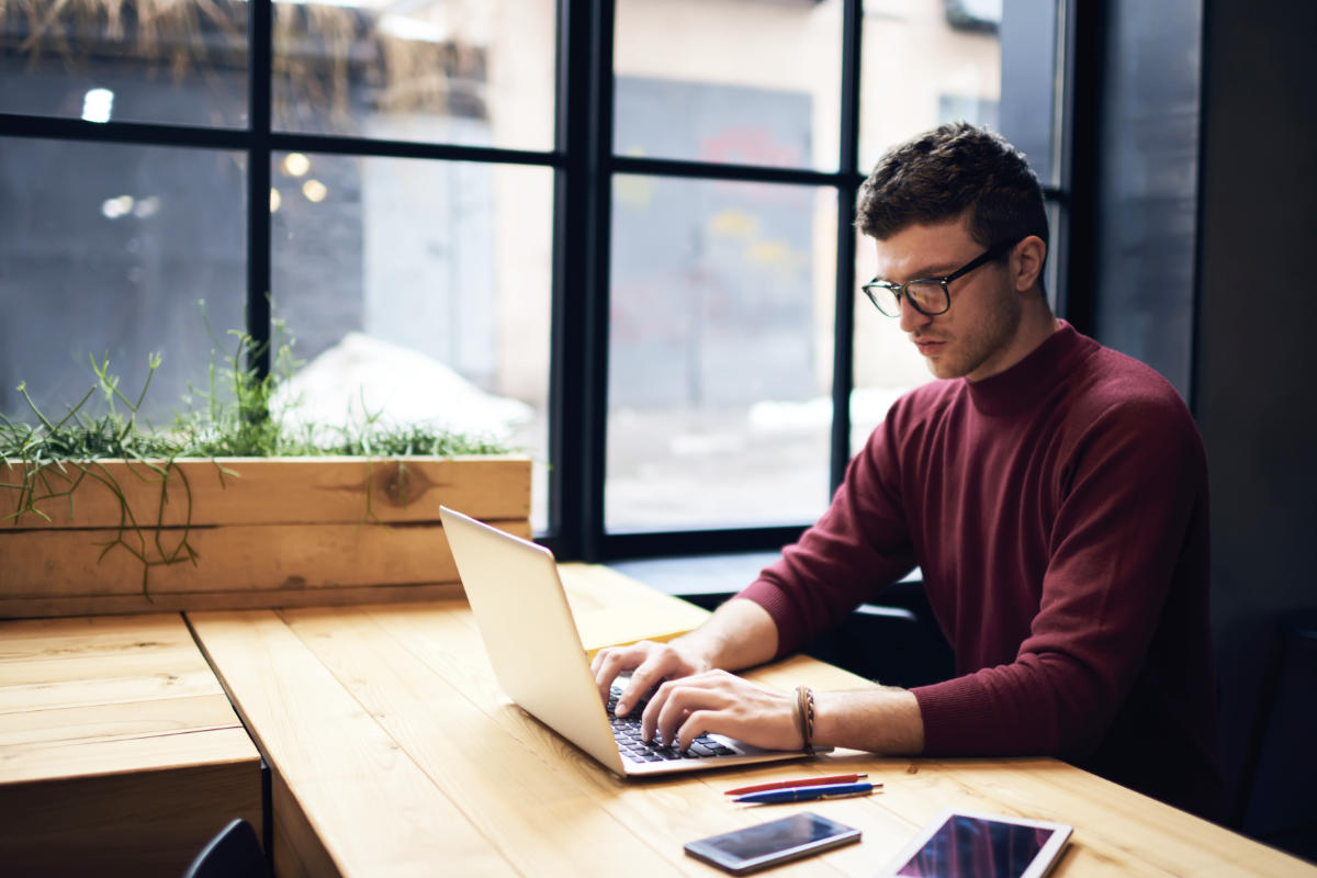 social media manager working on a laptop