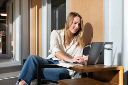 woman working on a MacBook