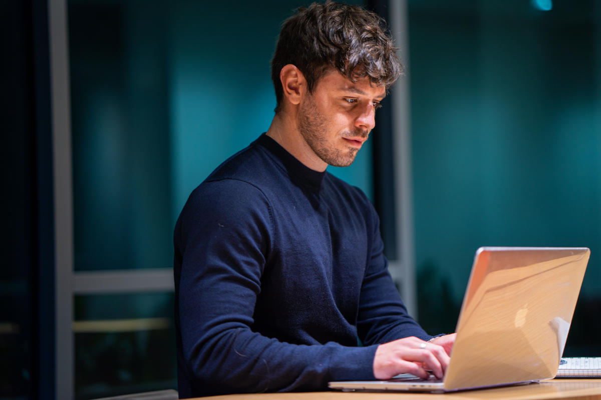 social media manager working on their laptop