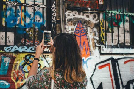 taking a photo of graffiti street art for social media